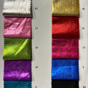 A display of vibrant Lycra jersey foils in various metallic colors, including gold, silver, and rose gold, neatly rolled and ready for wholesale purchase at a fabric shop. Each roll measures approximately 25 meters and showcases a soft, stretchy texture ideal for fashion projects.