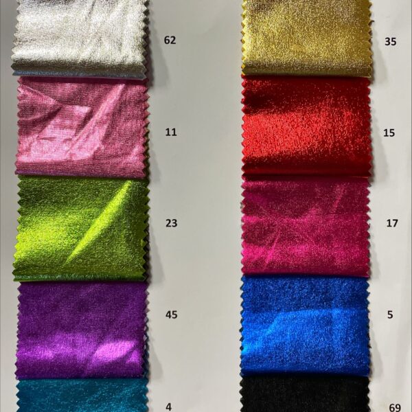 A display of vibrant Lycra jersey foils in various metallic colors, including gold, silver, and rose gold, neatly rolled and ready for wholesale purchase at a fabric shop. Each roll measures approximately 25 meters and showcases a soft, stretchy texture ideal for fashion projects.